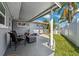 Comfortable outdoor patio with seating area and lush landscaping at 3906 Versailles Dr, Tampa, FL 33634