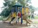 Community playground featuring slides and climbing structures, great for Gathering fun at 3906 Versailles Dr, Tampa, FL 33634