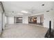 Spacious sunroom with tile flooring and an open view into the kitchen at 3906 Versailles Dr, Tampa, FL 33634