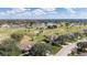Scenic aerial view of the community, featuring a pond, golf course, and well-maintained landscaping at 411 Bloom Ct # 2A, Sun City Center, FL 33573