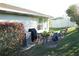 Inviting backyard patio with comfortable seating, perfect for outdoor dining and relaxation at 411 Bloom Ct # 2A, Sun City Center, FL 33573