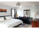 Bedroom featuring a stylish ceiling fan, neutral decor, and ample space at 411 Bloom Ct # 2A, Sun City Center, FL 33573