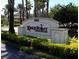 A well-maintained community sign welcomes residents and guests with professional landscaping at 411 Bloom Ct # 2A, Sun City Center, FL 33573