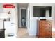 Hallway with shelving and storage that leads to a bathroom at 411 Bloom Ct # 2A, Sun City Center, FL 33573