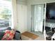 Sun room featuring a sliding glass door leading to a bedroom at 411 Bloom Ct # 2A, Sun City Center, FL 33573