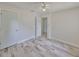 Cozy bedroom featuring wood-look floors, ceiling fan, and closet at 434 Pevetty Dr, Plant City, FL 33563