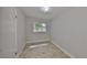 Neutral bedroom with wood-look tile floors, window, and gray paint at 434 Pevetty Dr, Plant City, FL 33563