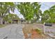 Charming single-story home featuring a covered carport and driveway at 434 Pevetty Dr, Plant City, FL 33563