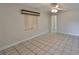 Comfortable living space with tiled floors, modern blinds, and natural light filling the room at 434 Pevetty Dr, Plant City, FL 33563
