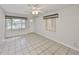 Inviting living room with tile floors, modern ceiling fan, natural light, and a welcoming atmosphere at 434 Pevetty Dr, Plant City, FL 33563