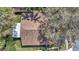 Overhead view of the property showcasing the roof, landscaping, and surrounding neighborhood at 4932 Wellbrook Dr, New Port Richey, FL 34653