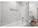 Modern bathroom featuring a marble shower, niche, and updated vanity at 4932 Wellbrook Dr, New Port Richey, FL 34653