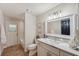 Modern bathroom with a marble countertop vanity and glass door shower at 4932 Wellbrook Dr, New Port Richey, FL 34653