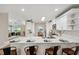 Open concept kitchen and breakfast bar with pendant lighting and modern finishes at 4932 Wellbrook Dr, New Port Richey, FL 34653