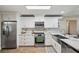 Well-lit kitchen featuring stainless steel appliances and white marble countertops at 4932 Wellbrook Dr, New Port Richey, FL 34653