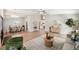 Open-concept living space with wood floors and a view into the dining area, and lots of natural light at 4932 Wellbrook Dr, New Port Richey, FL 34653