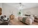 Serene main bedroom featuring plush bedding, natural light, and stylish decor at 4932 Wellbrook Dr, New Port Richey, FL 34653