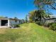 Spacious backyard with a well-maintained lawn, providing ample outdoor space at 4976 12Th N Ave, St Petersburg, FL 33710