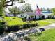 A charming front yard with green grass and an American flag at 4976 12Th N Ave, St Petersburg, FL 33710