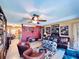 Spacious living area with eclectic decor, a wall of records, and comfortable seating at 4976 12Th N Ave, St Petersburg, FL 33710