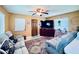 Cozy living room featuring a large TV, comfortable seating, and decorative accents at 4976 12Th N Ave, St Petersburg, FL 33710