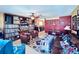 Spacious living area with eclectic decor, a wall of records, and comfortable seating at 4976 12Th N Ave, St Petersburg, FL 33710