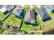 An aerial view of a property featuring a well-maintained yard and landscaping at 5016 Bella Armonia Cir, Wimauma, FL 33598