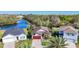 Aerial view of homes and community with lake in the background at 5016 Bella Armonia Cir, Wimauma, FL 33598
