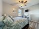 Comfortable bedroom featuring a ceiling fan, TV, and neutral decor for a serene retreat at 5016 Bella Armonia Cir, Wimauma, FL 33598