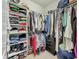 Walk-in closet with ample storage and organization for clothes and accessories at 5016 Bella Armonia Cir, Wimauma, FL 33598