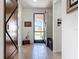 Entryway with decorative barn door with view of the front yard through the doorway at 5016 Bella Armonia Cir, Wimauma, FL 33598