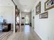 Hallway featuring a barn door leading to the front entryway with view of yard at 5016 Bella Armonia Cir, Wimauma, FL 33598