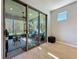 Relaxing sunroom featuring tile flooring, sliding glass doors to outdoors, and comfortable seating at 5016 Bella Armonia Cir, Wimauma, FL 33598