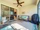 Inviting screened patio with ceiling fan, outdoor furniture, and access to the backyard at 5016 Bella Armonia Cir, Wimauma, FL 33598