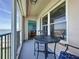 Balcony with table and chairs offering beautiful views and seamless indoor-outdoor living at 5220 Brittany S Dr # 1108, St Petersburg, FL 33715