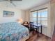 Bedroom with a scenic view, decorative art, and a comfortable work area at 5220 Brittany S Dr # 1108, St Petersburg, FL 33715