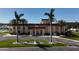 View of the community clubhouse featuring manicured landscaping and an American flag at 5220 Brittany S Dr # 1108, St Petersburg, FL 33715