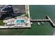 Waterfront condo featuring pool, lounge area, landscaping, and easy dock access at 5220 Brittany S Dr # 1108, St Petersburg, FL 33715