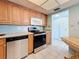 Well-maintained kitchen with stainless steel dishwasher and range at 5220 Brittany S Dr # 1108, St Petersburg, FL 33715