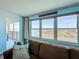 Living room with a large window and balcony access offers stunning water views at 5220 Brittany S Dr # 1108, St Petersburg, FL 33715