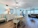 Charming dining and living area with water views and wood flooring at 5220 Brittany S Dr # 1108, St Petersburg, FL 33715