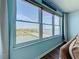 Bright living room with large windows showcasing a scenic water view at 5220 Brittany S Dr # 1108, St Petersburg, FL 33715