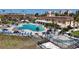 Community pool with lounge chairs and a hot tub at 5220 Brittany S Dr # 1108, St Petersburg, FL 33715