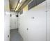 Hallway of storage units, each with a number, and equipped with locks, providing safe space at 5220 Brittany S Dr # 1108, St Petersburg, FL 33715