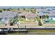 A waterfront backyard with a fence, pool, and a private dock, ideal for relaxation and outdoor entertaining at 5709 Sea Turtle Pl, Apollo Beach, FL 33572