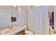 Bathroom featuring a single vanity, toilet, and a shower with a white curtain at 5709 Sea Turtle Pl, Apollo Beach, FL 33572