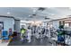 Well-equipped fitness center with modern exercise machines, ample space, and natural light at 5709 Sea Turtle Pl, Apollo Beach, FL 33572