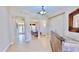 Inviting foyer leads to the dining area, showcasing an elegant light fixture at 5709 Sea Turtle Pl, Apollo Beach, FL 33572