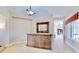 Elegant foyer with decorative mirror and views of the open-concept layout at 5709 Sea Turtle Pl, Apollo Beach, FL 33572