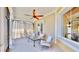 Inviting porch area with comfortable seating and a ceiling fan for relaxing outdoor enjoyment at 5709 Sea Turtle Pl, Apollo Beach, FL 33572